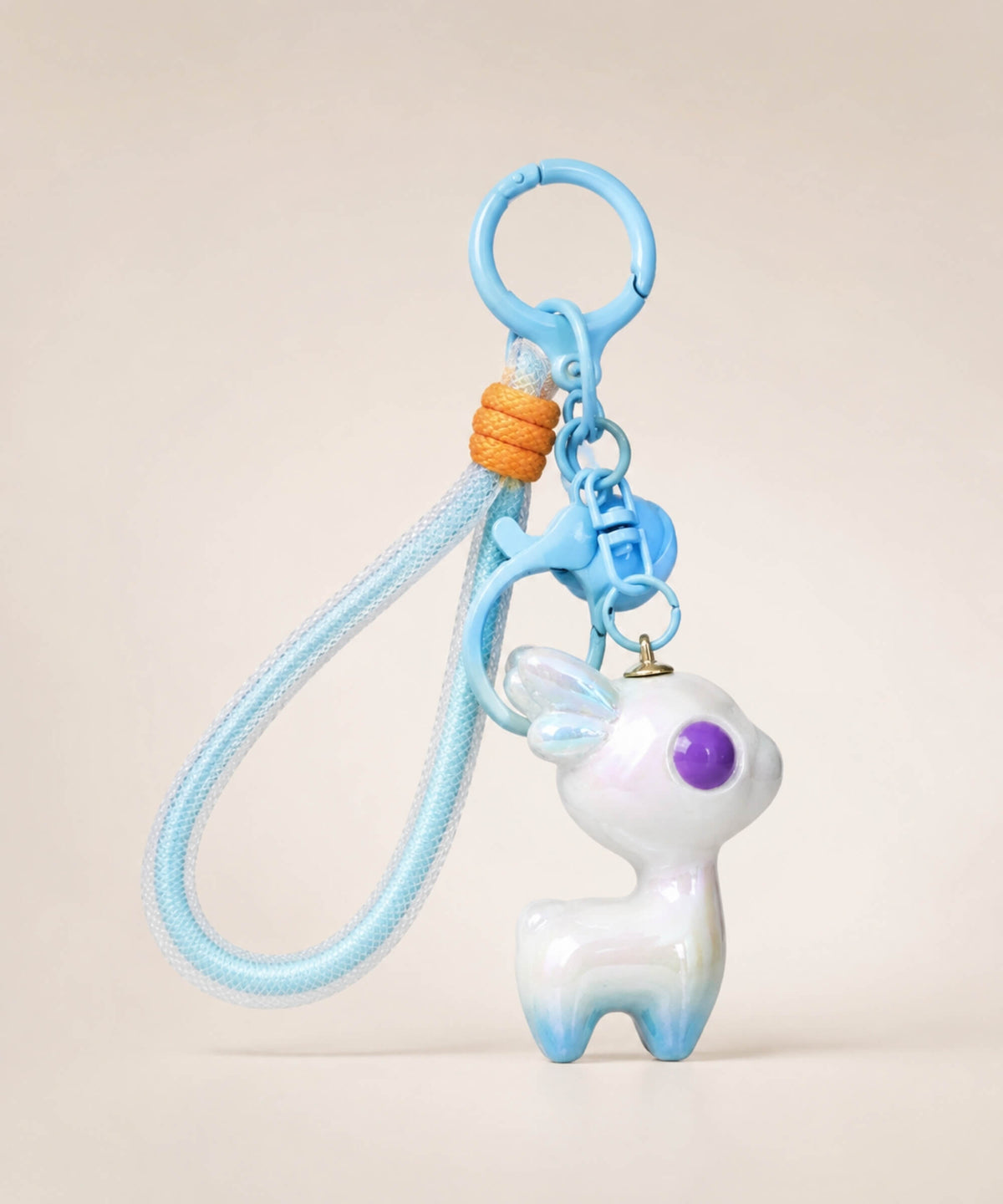 Blue iridescent deer resin keychain with matching blue strap, purple eye detail and pastel pearlescent finish