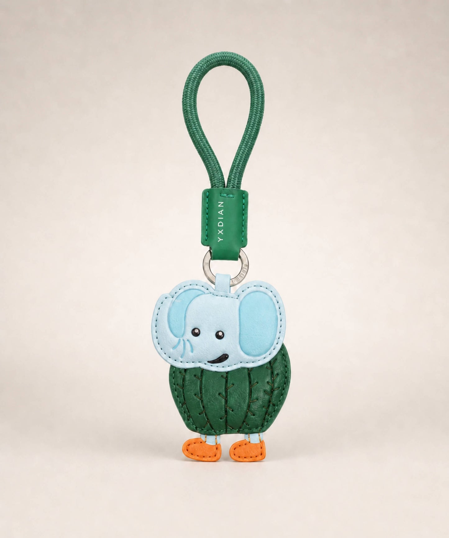 Lirily Larila Italian Brainrot style PU leather keychain with green wrist strap on a clean studio background.