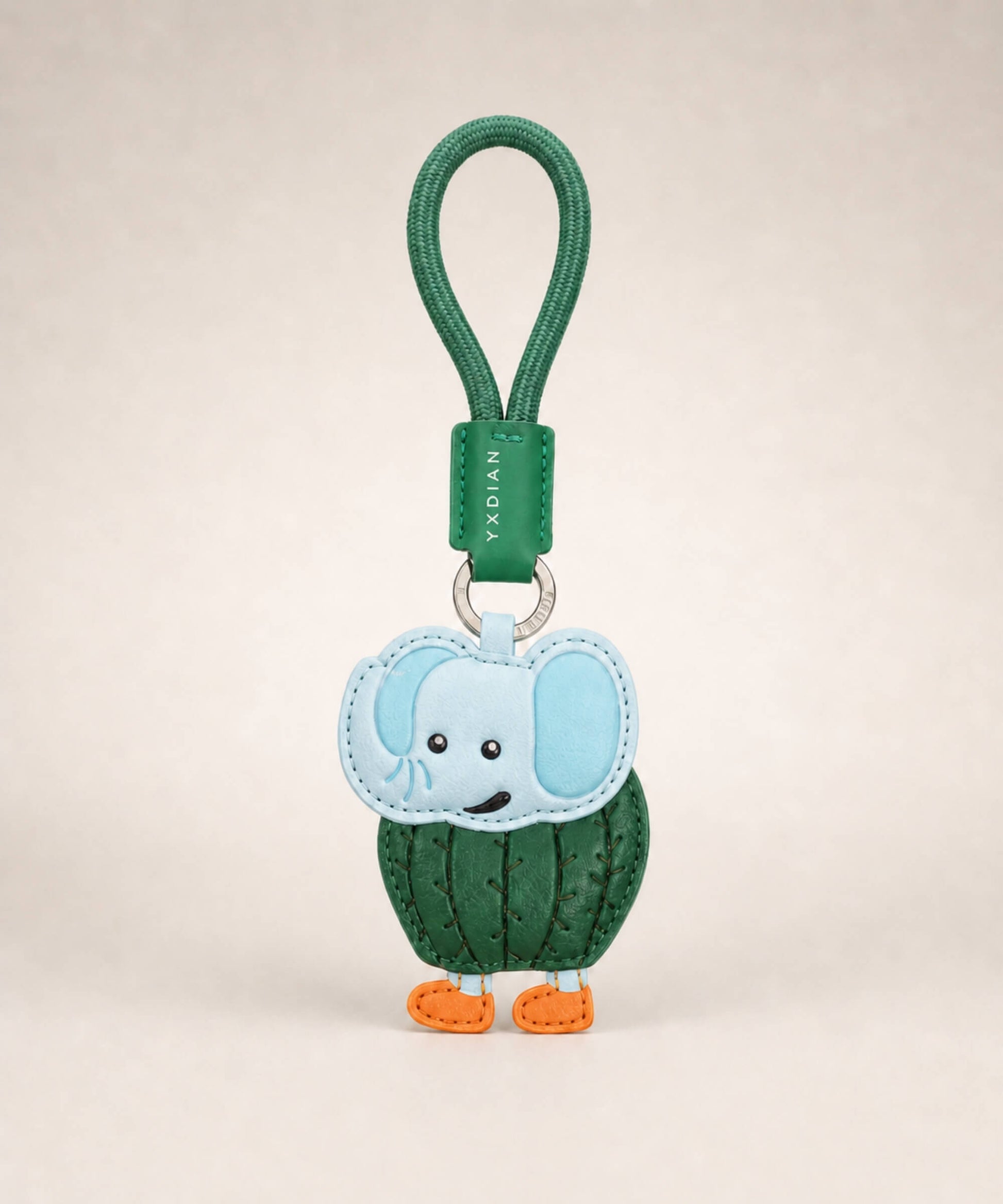 Lirily Larila Italian Brainrot style PU leather keychain with green wrist strap on a clean studio background.