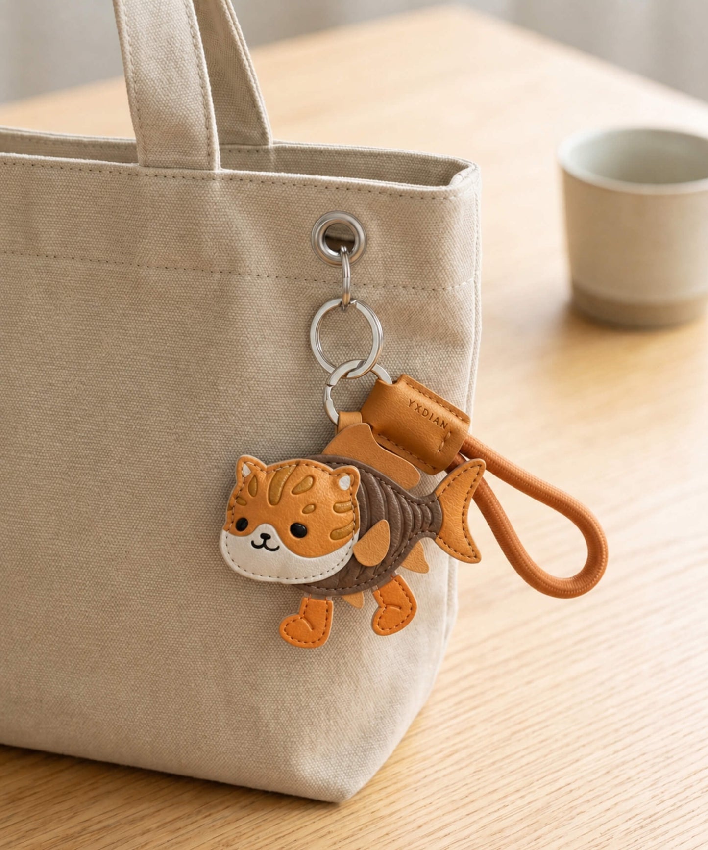 Trulimero Trulicina Italian Brainrot style PU leather keychain attached to a canvas tote bag in a lifestyle setting.