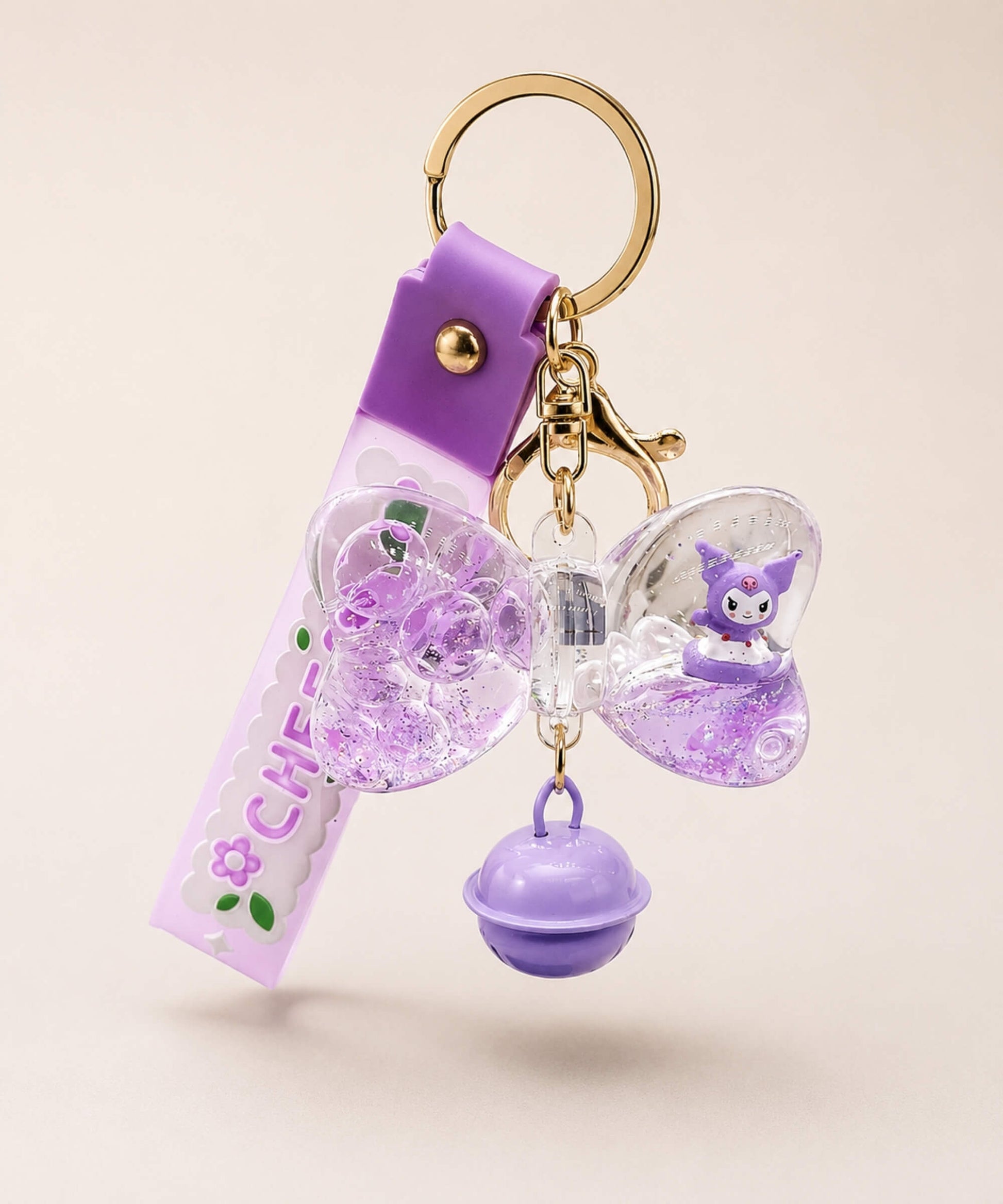 Purple starfish liquid keychain with purple glitter, shell detail, floral strap and gold hardware