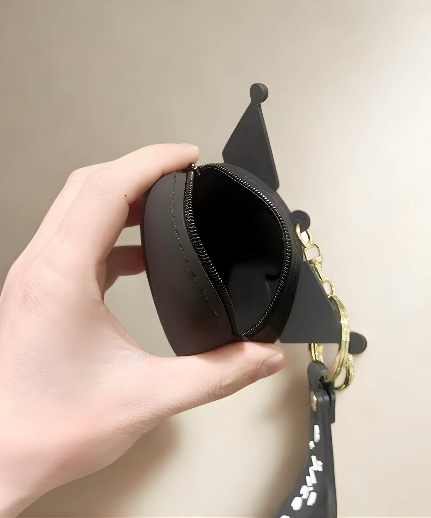 Kuromi silicone coin purse keychain showing zipper opening and storage space