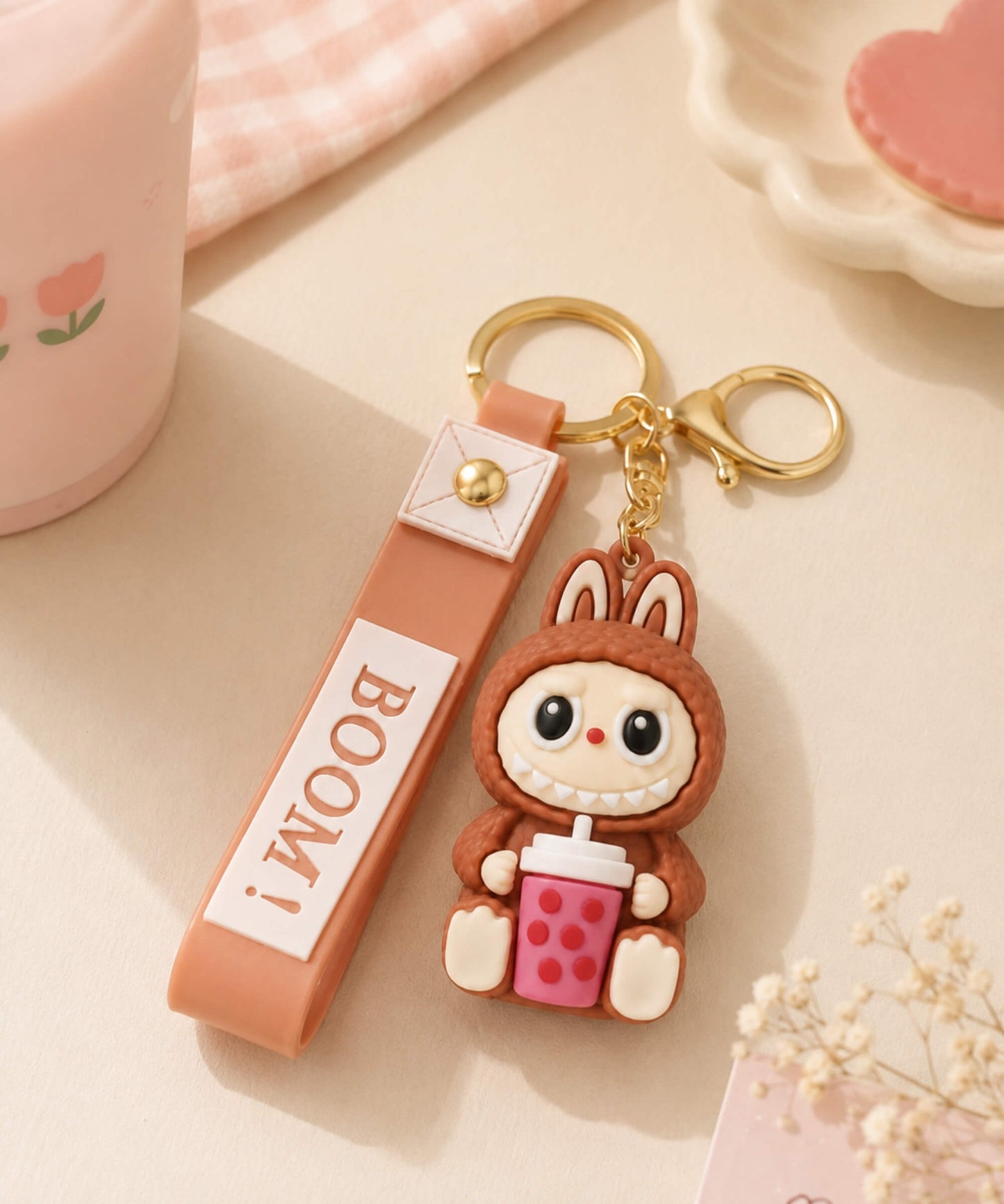 Brown Labubu style bubble tea keychain flatlay