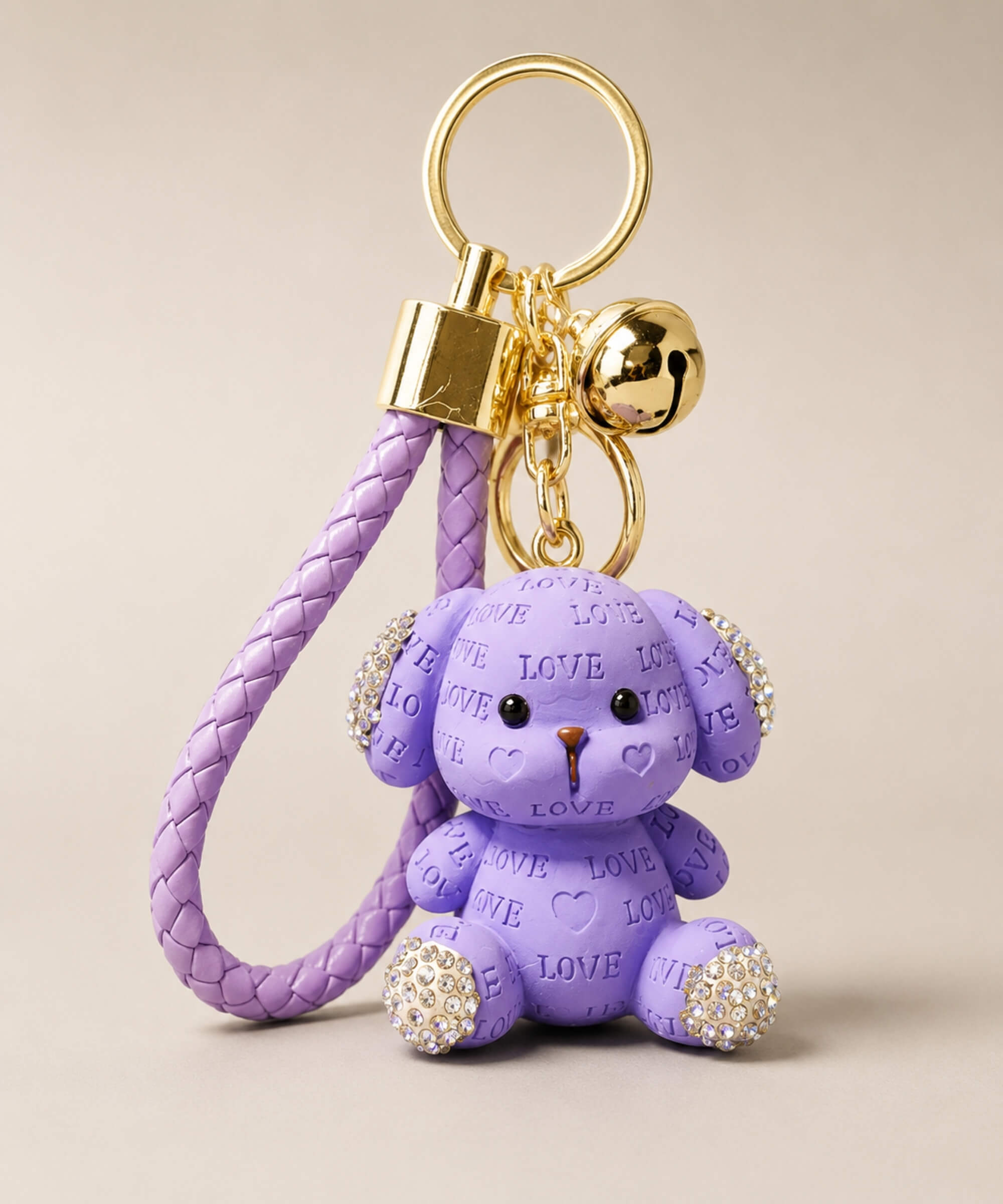 Purple love puppy resin keychain on a neutral background.