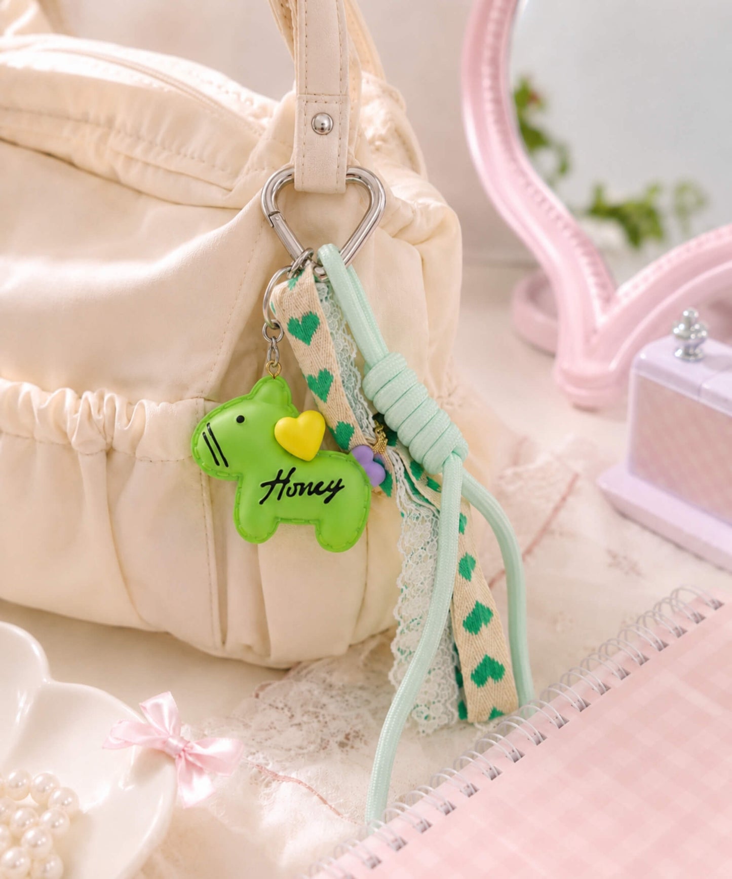 Green pony phone charm on bag