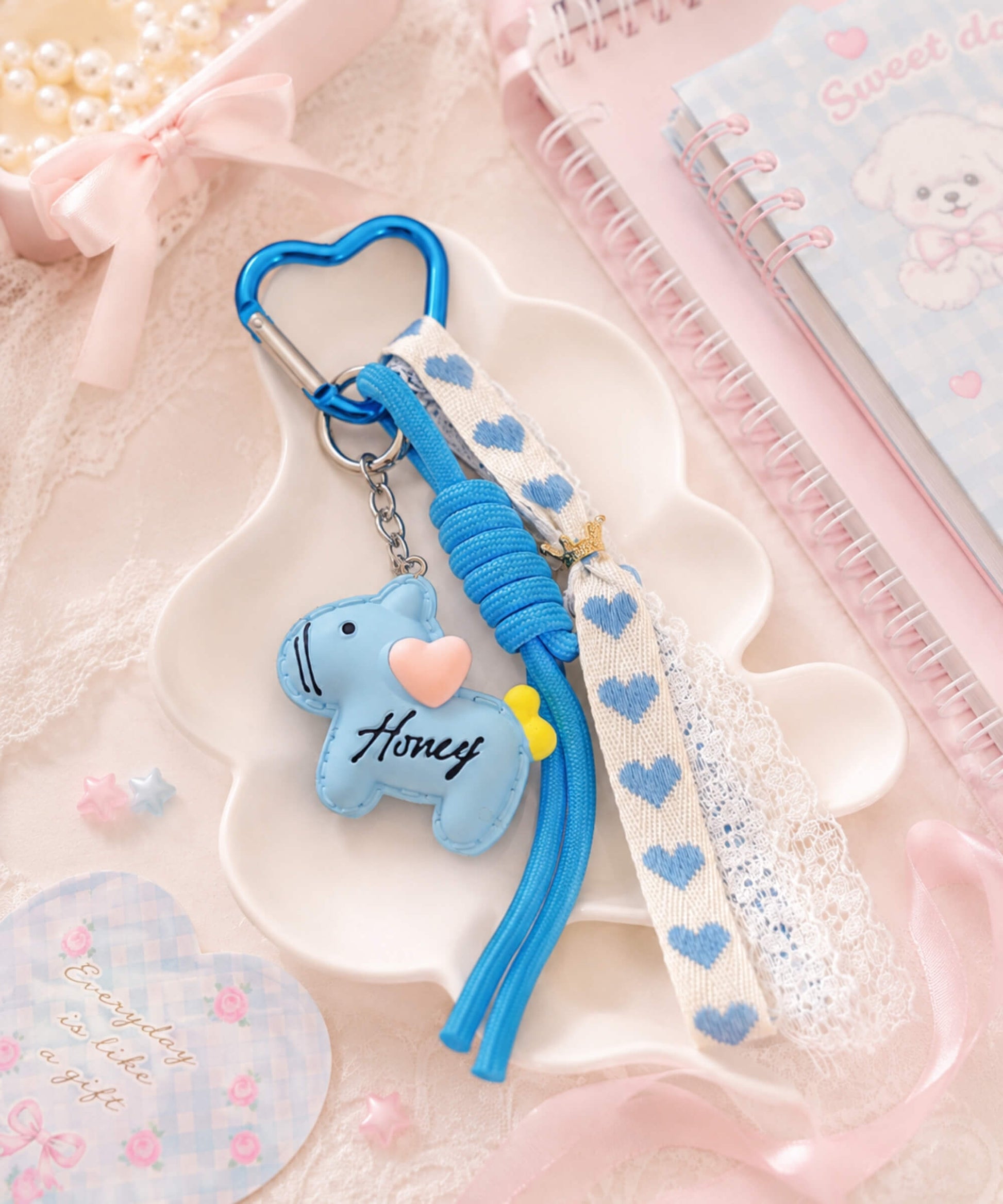 Blue pony resin phone charm flatlay