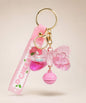 My Melody pink bow liquid keychain with glitter, pink bell, pink strap and gold hardware