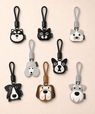 Assorted pet face PU leather bag charm keychains in dog and cat designs displayed together on a neutral background.