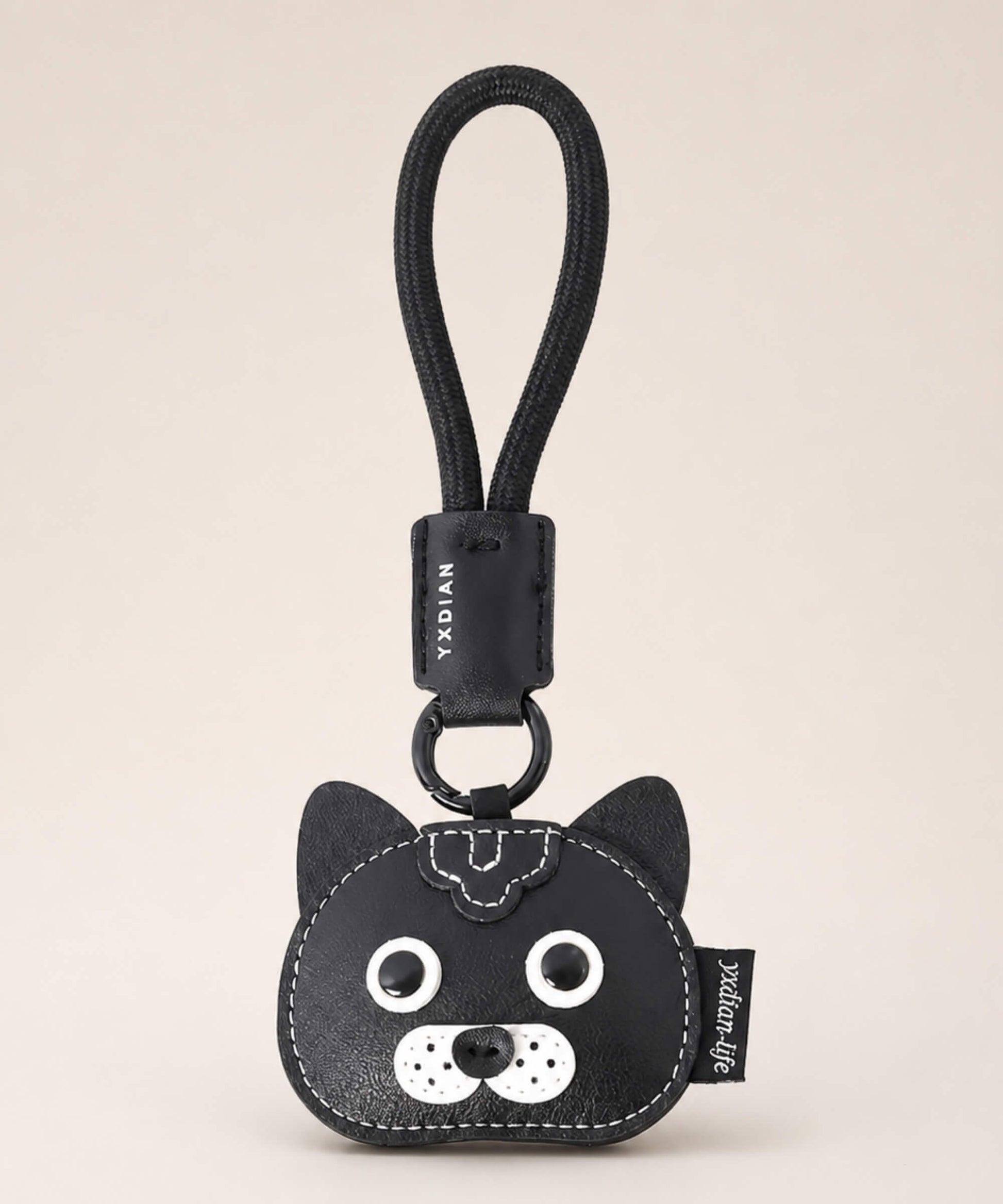 Black cat pet face PU leather bag charm keychain on a neutral background.