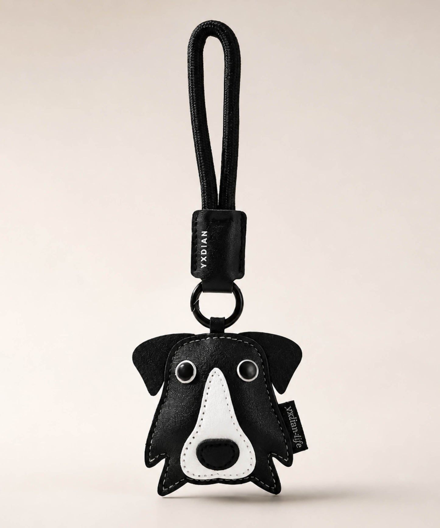 Border Collie pet face PU leather bag charm keychain on a neutral background.