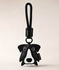 Border Collie pet face PU leather bag charm keychain on a neutral background.