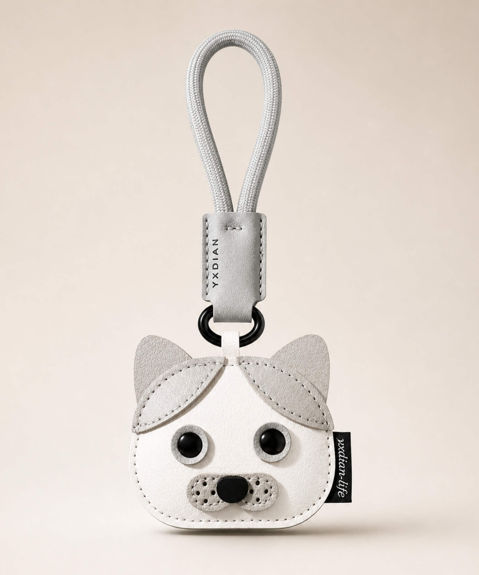 Grey cat pet face PU leather bag charm keychain on a neutral background.