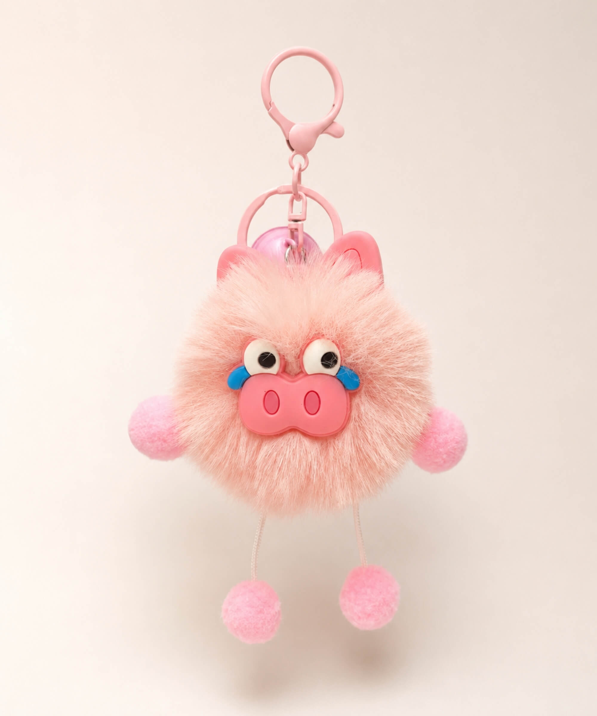 Pig plush keychain with soft pink fluffy body, pig face detail, bell charm and pink clip