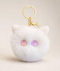 Pink eye cat plush keychain with white fluffy body, pastel pink and purple star eyes and gold hardware