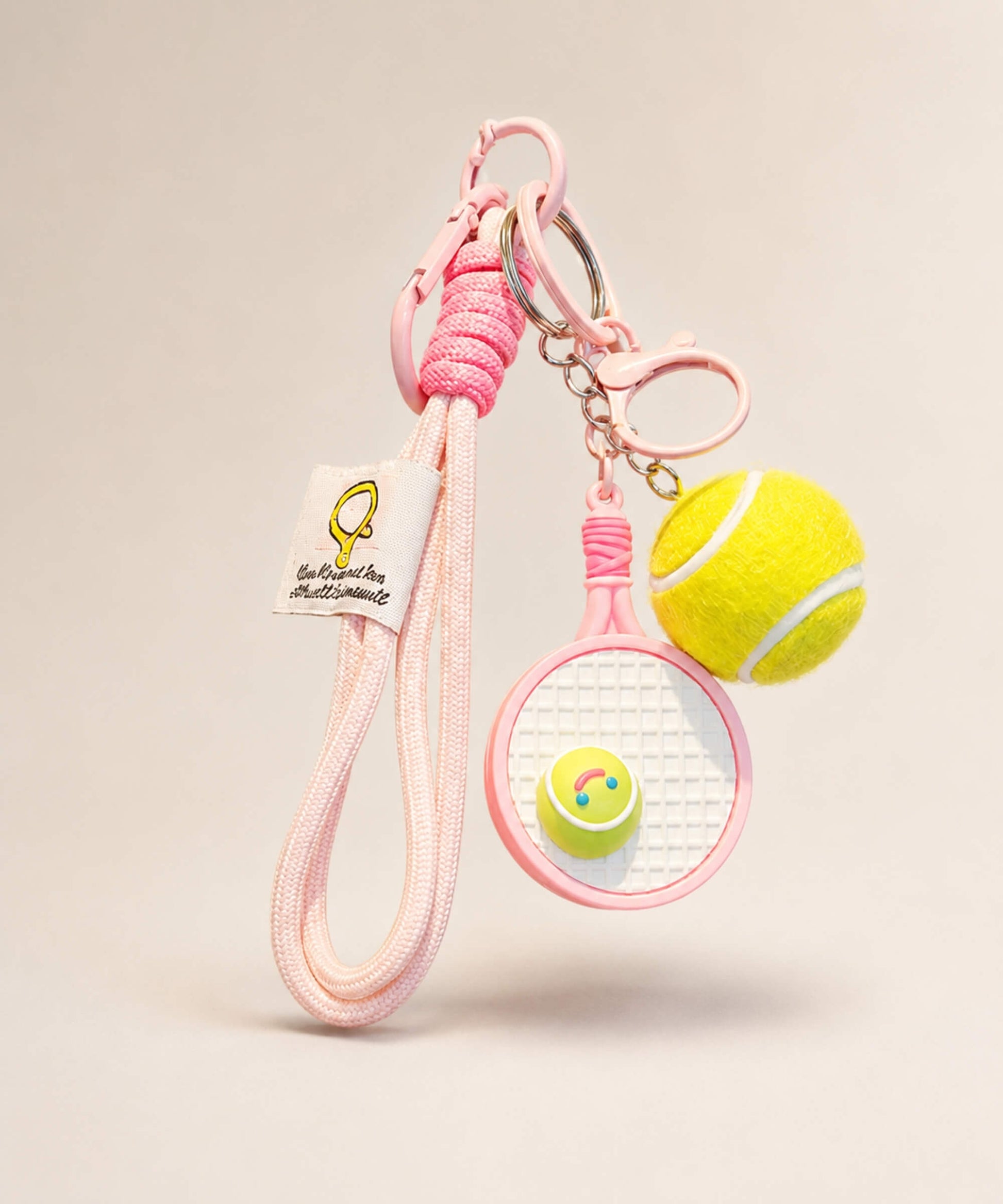 Pink tennis racket rope keychain with tennis ball charm and long cord strap