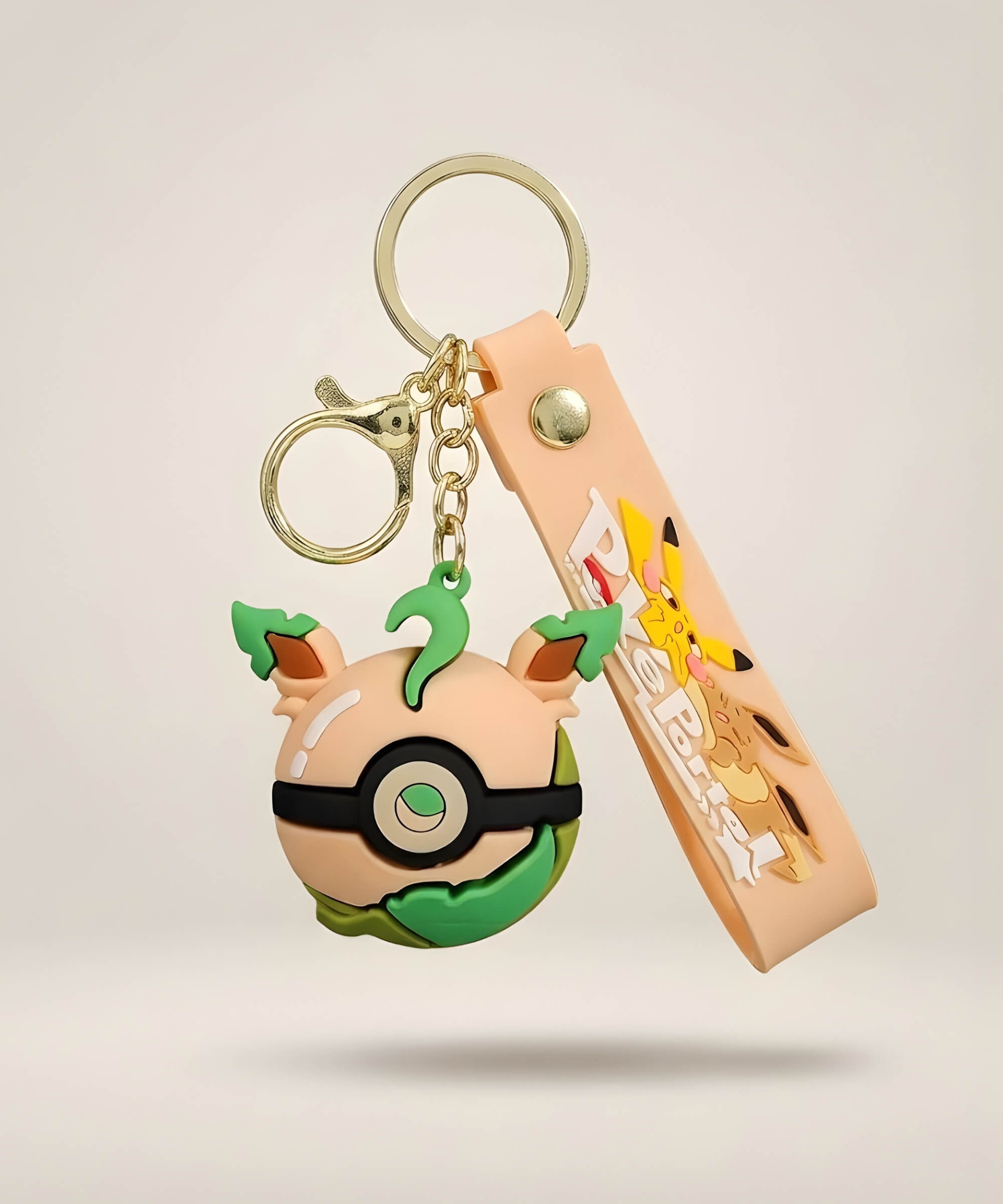 Leaf green Poke Ball-inspired strap keychain with green accent 3D charm, peach strap and gold-tone hardware