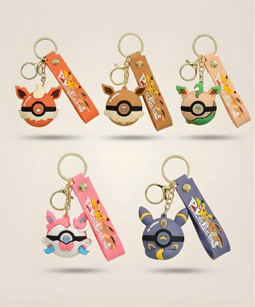 Poke Ball-inspired strap keychains in five anime-style designs with colourful charms and matching wrist straps