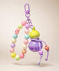 Purple whale beaded keychain with glossy purple beads, bow charm and heart detail