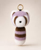 Purple raccoon plush keychain with brown and white details and gold key ring