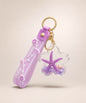 Kuromi purple bow liquid keychain with glitter, purple bell, purple strap and gold hardware