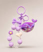 Purple whale beaded keychain with glossy purple beads, bow charm and heart detail