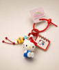 Hello Kitty book Sanrio keychain with red strap, mini notebook charm and character details