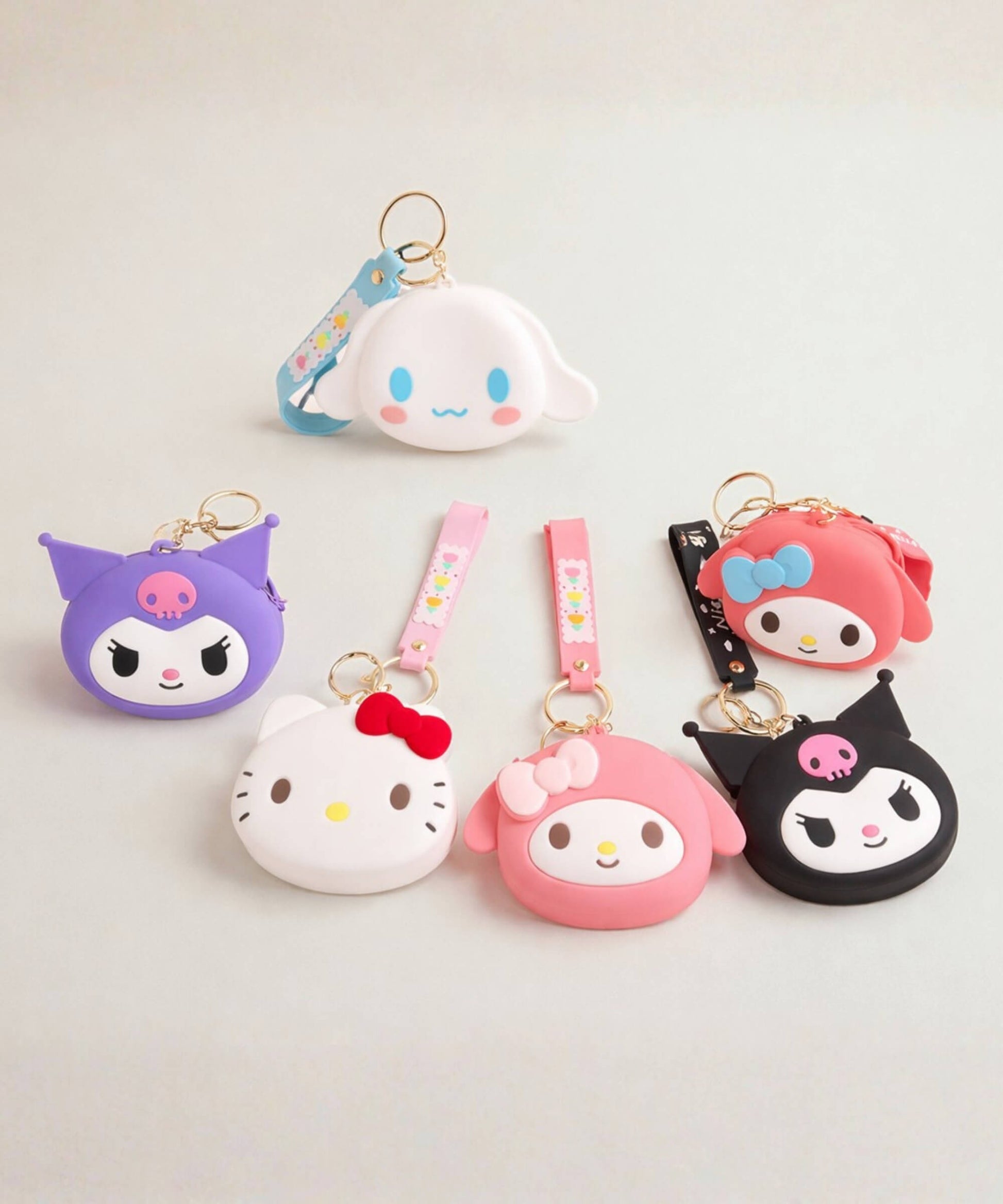 Sanrio silicone coin purse keychain set featuring Hello Kitty, Kuromi, My Melody and Cinnamoroll, cute character bag charms