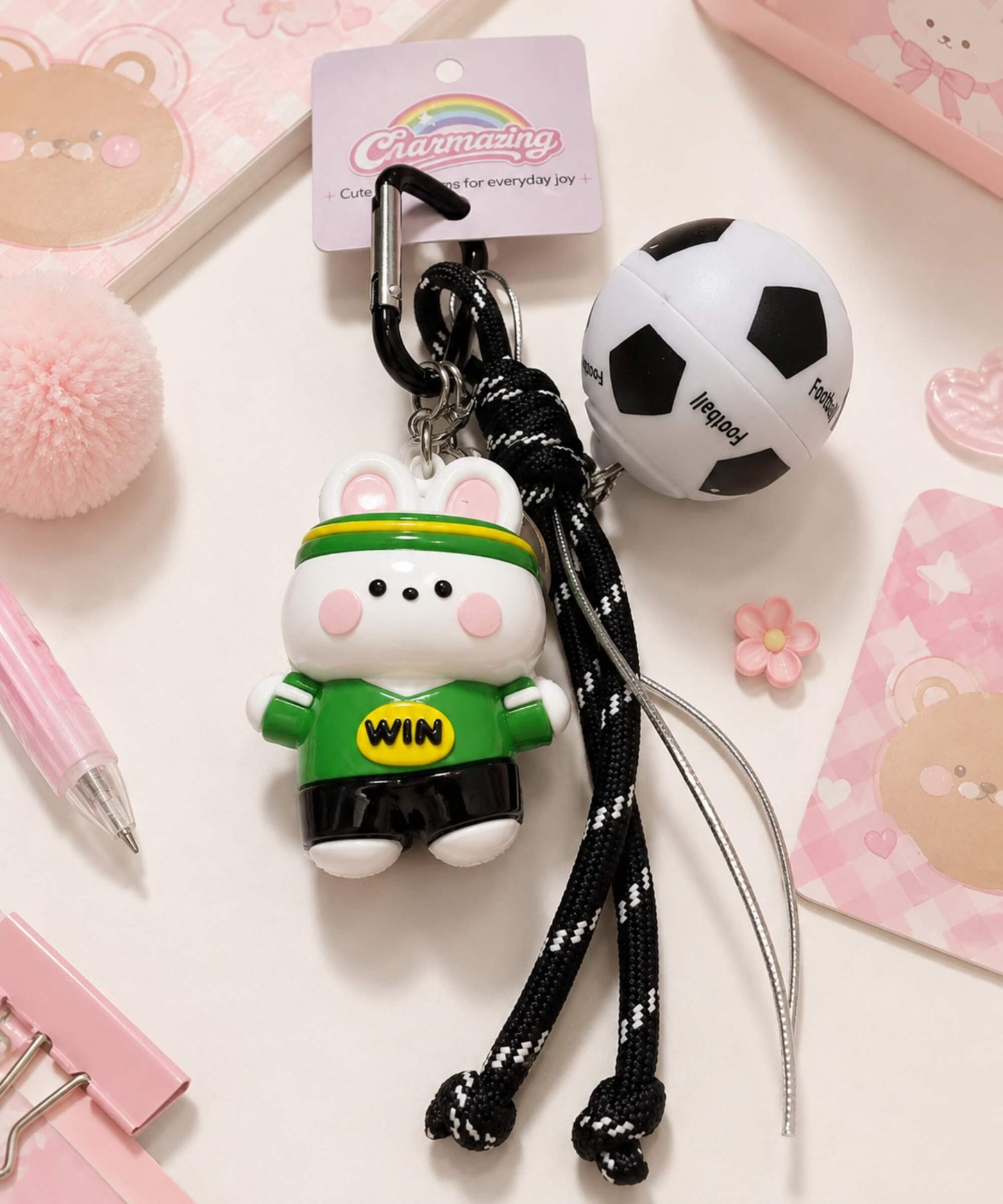Soccer ball spinner keychain with green team bunny charm, rotating football detail and rope-style strap