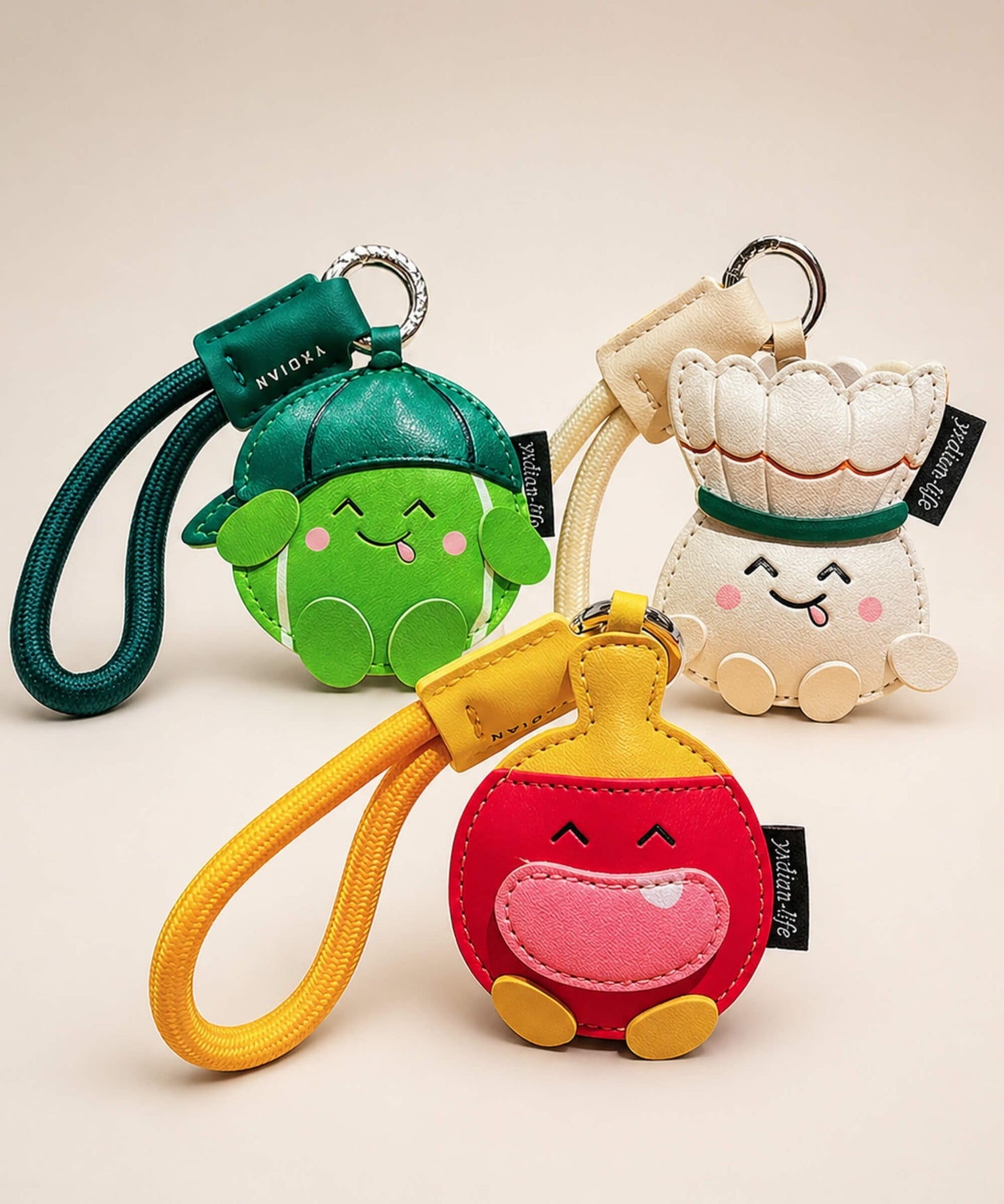 CHARMAZING sports PU leather bag charm keychains featuring badminton, table tennis and tennis designs.
