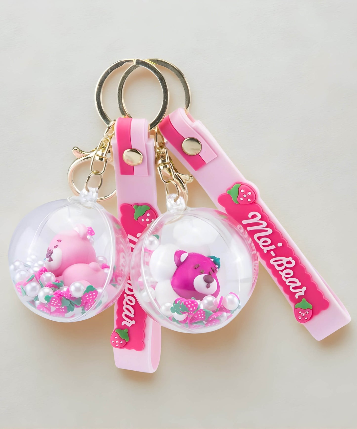 Strawberry bear shaker keychains with strap and floating beads in multiple styles