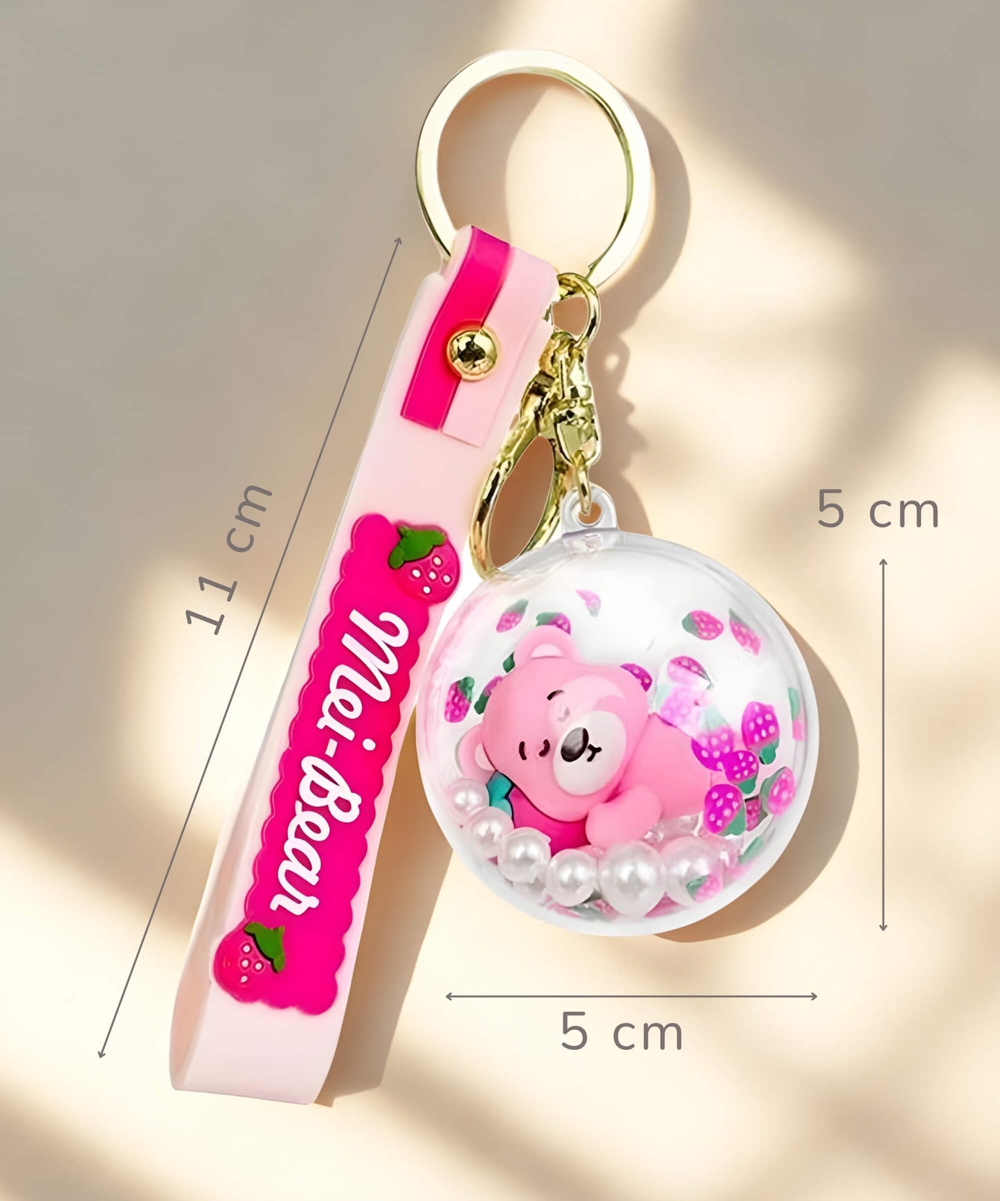 Strawberry bear shaker keychain size reference with strap and round charm dimensions