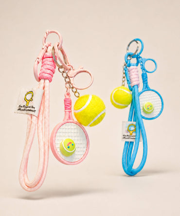 Pink and blue tennis racket rope keychains with tennis ball charms and long cord straps