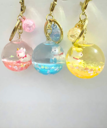 Unicorn style liquid glitter keychain set with crystal ball design and floating glitter effect