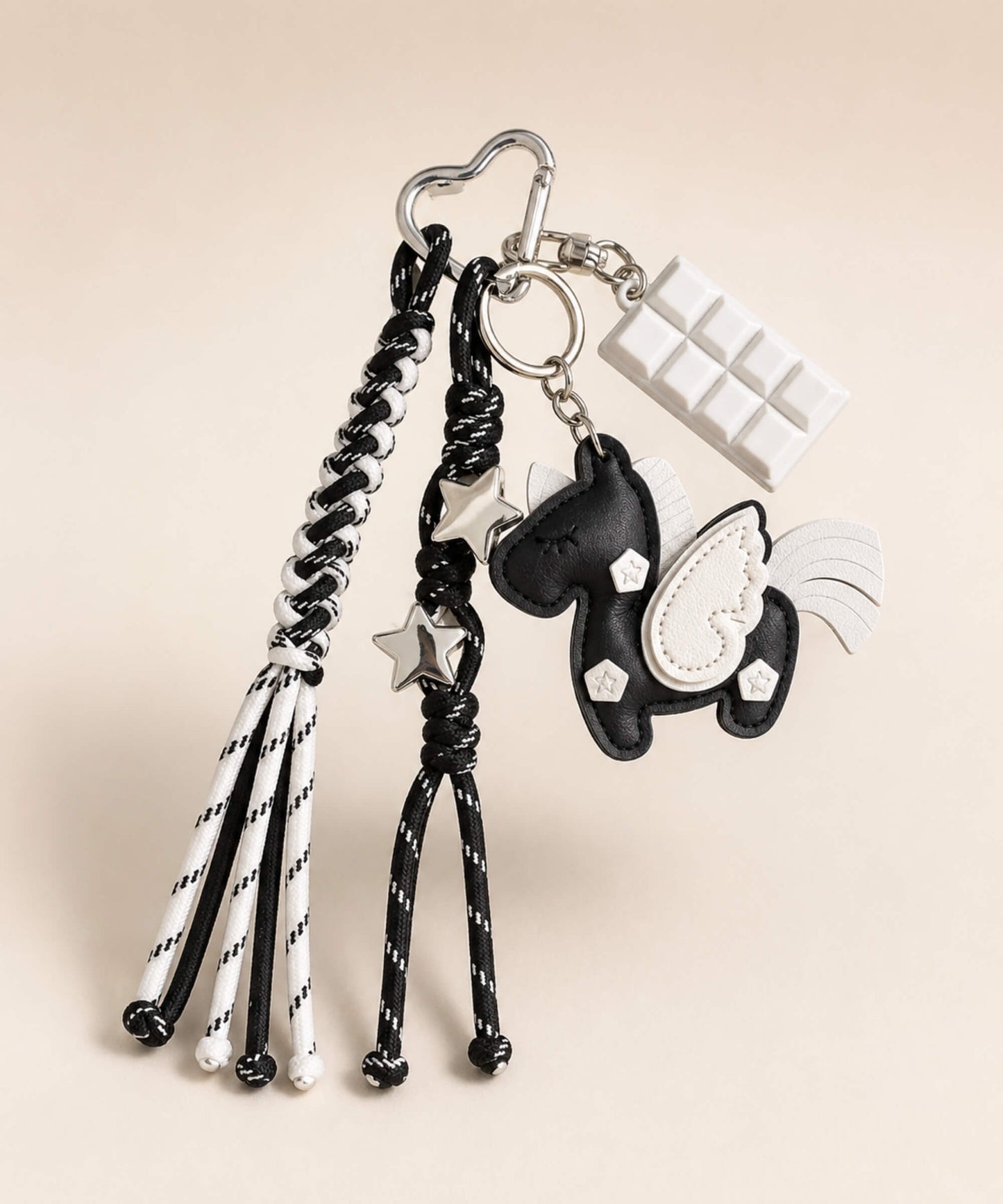 Black unicorn PU leather bag charm keychain with white wing, star charms and white chocolate charm.