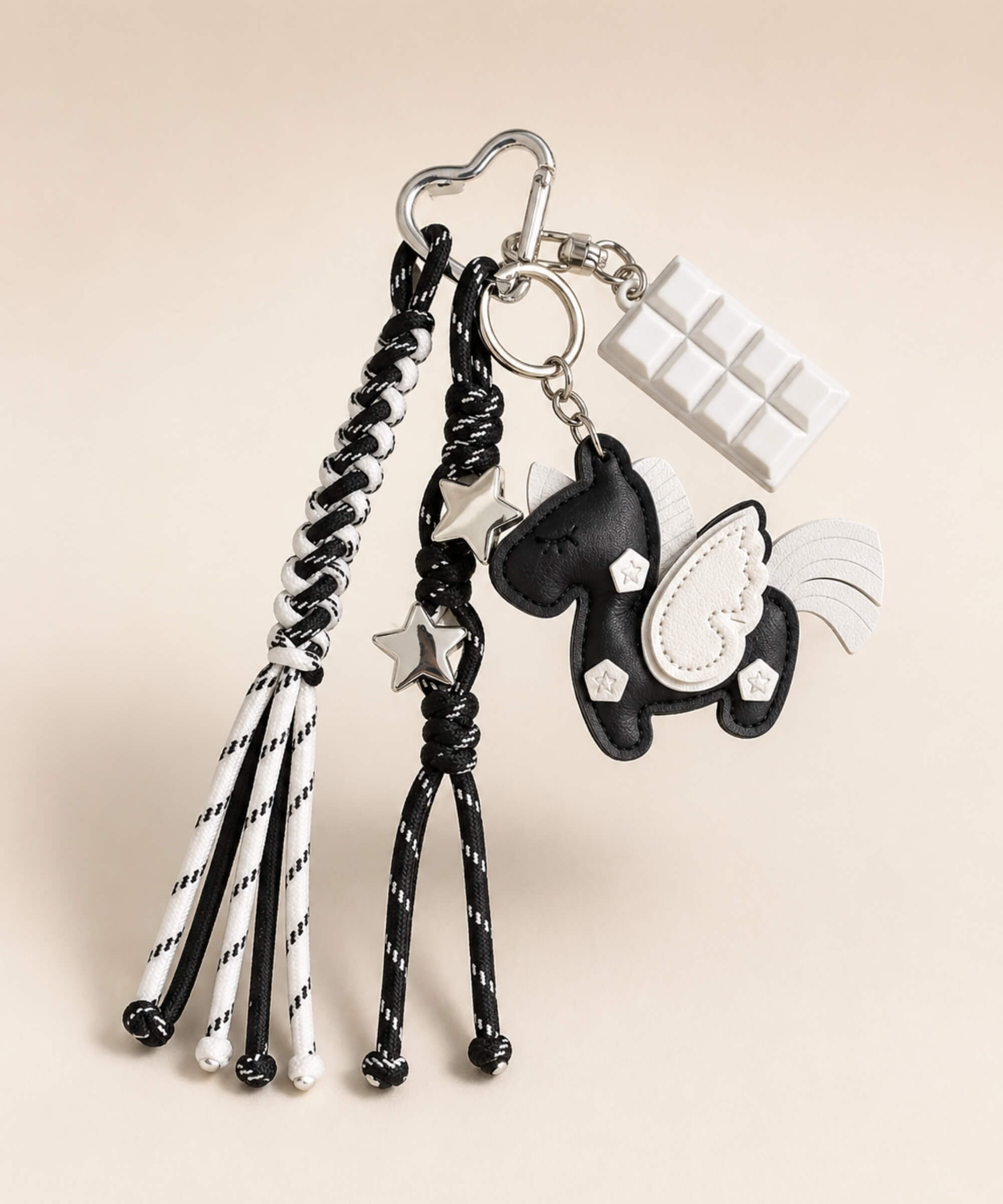 Black unicorn PU leather bag charm keychain with white wing, star charms and white chocolate charm.
