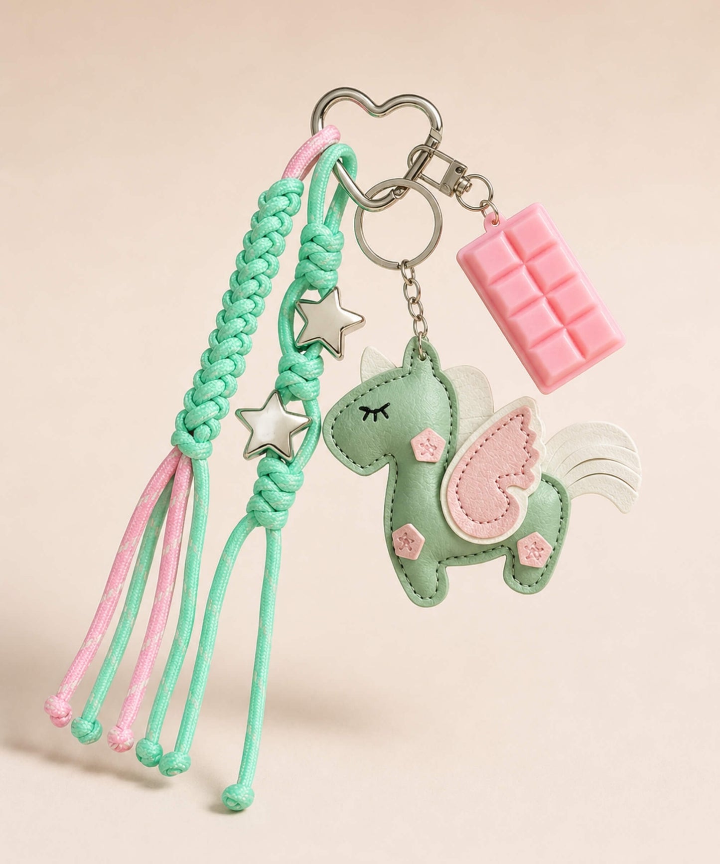 Green unicorn PU leather bag charm keychain with pink wing, star charms and pink chocolate charm.