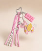 Pink unicorn PU leather bag charm keychain with star and chocolate charms on a clean neutral background.