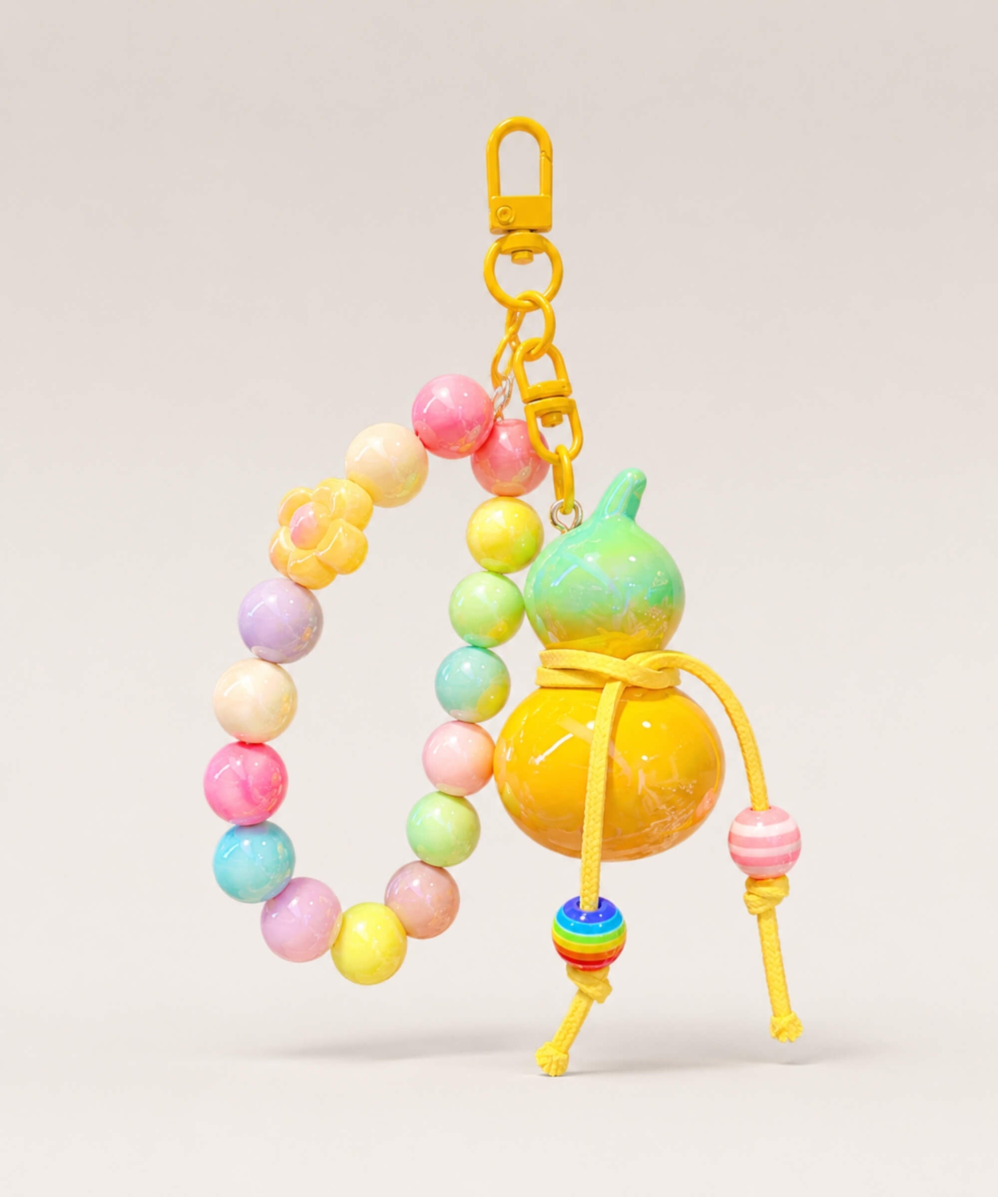 Yellow gourd beaded keychain with colourful beads, cord details and yellow clasp