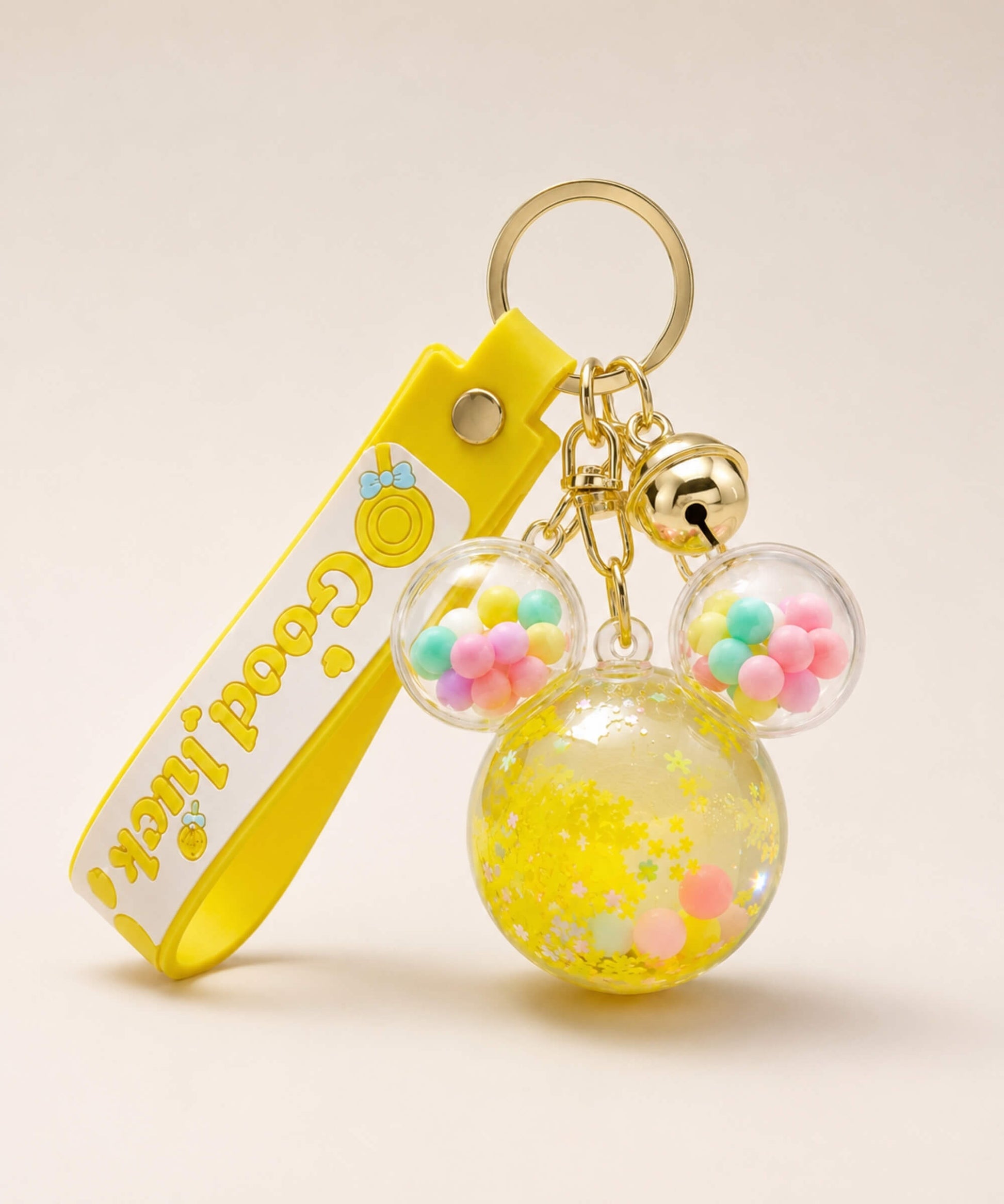 Yellow Mickey head liquid keychain with yellow glitter, pastel beads, yellow strap and gold hardware