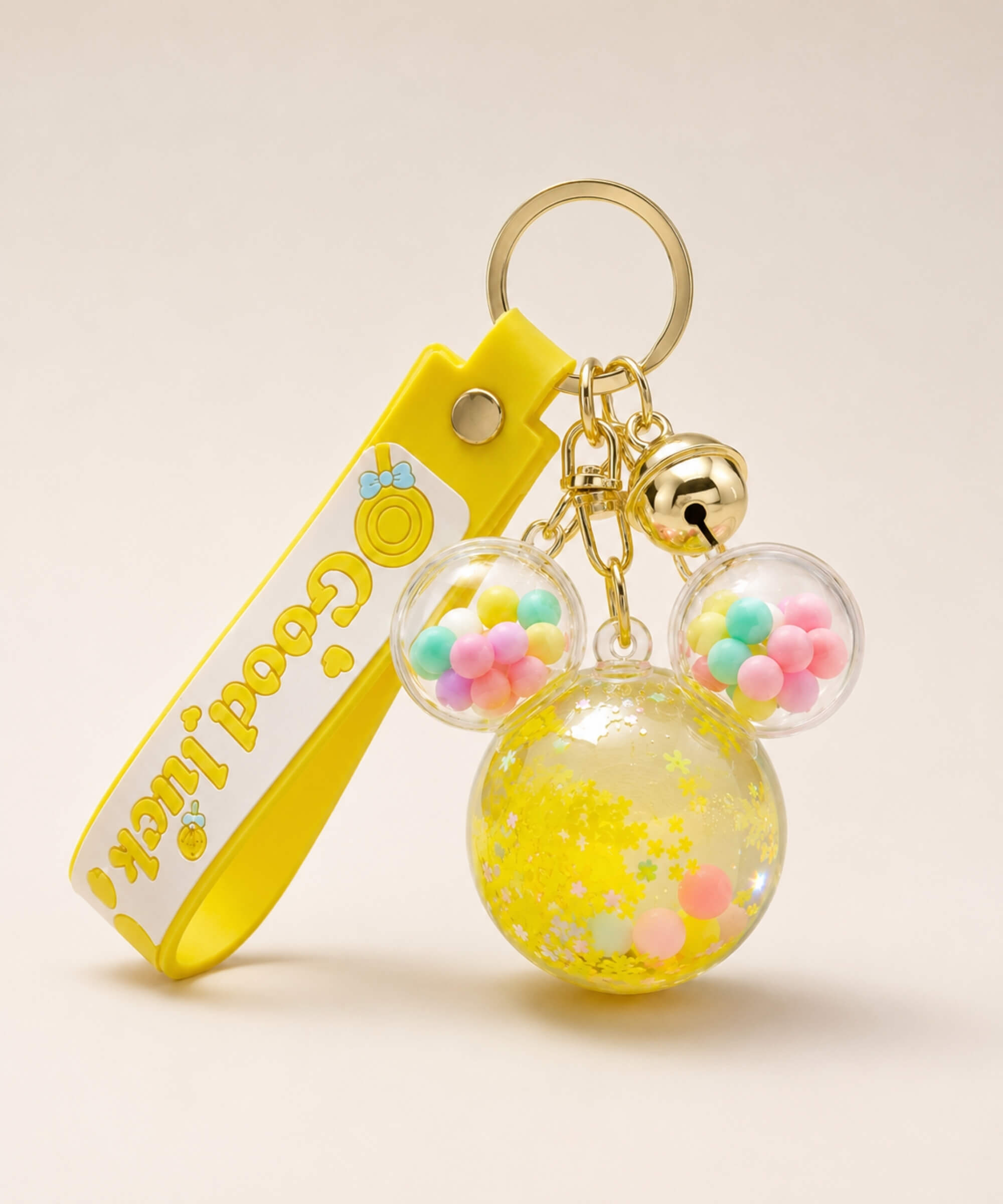 Yellow Mickey head liquid keychain with yellow glitter, pastel beads, yellow strap and gold hardware