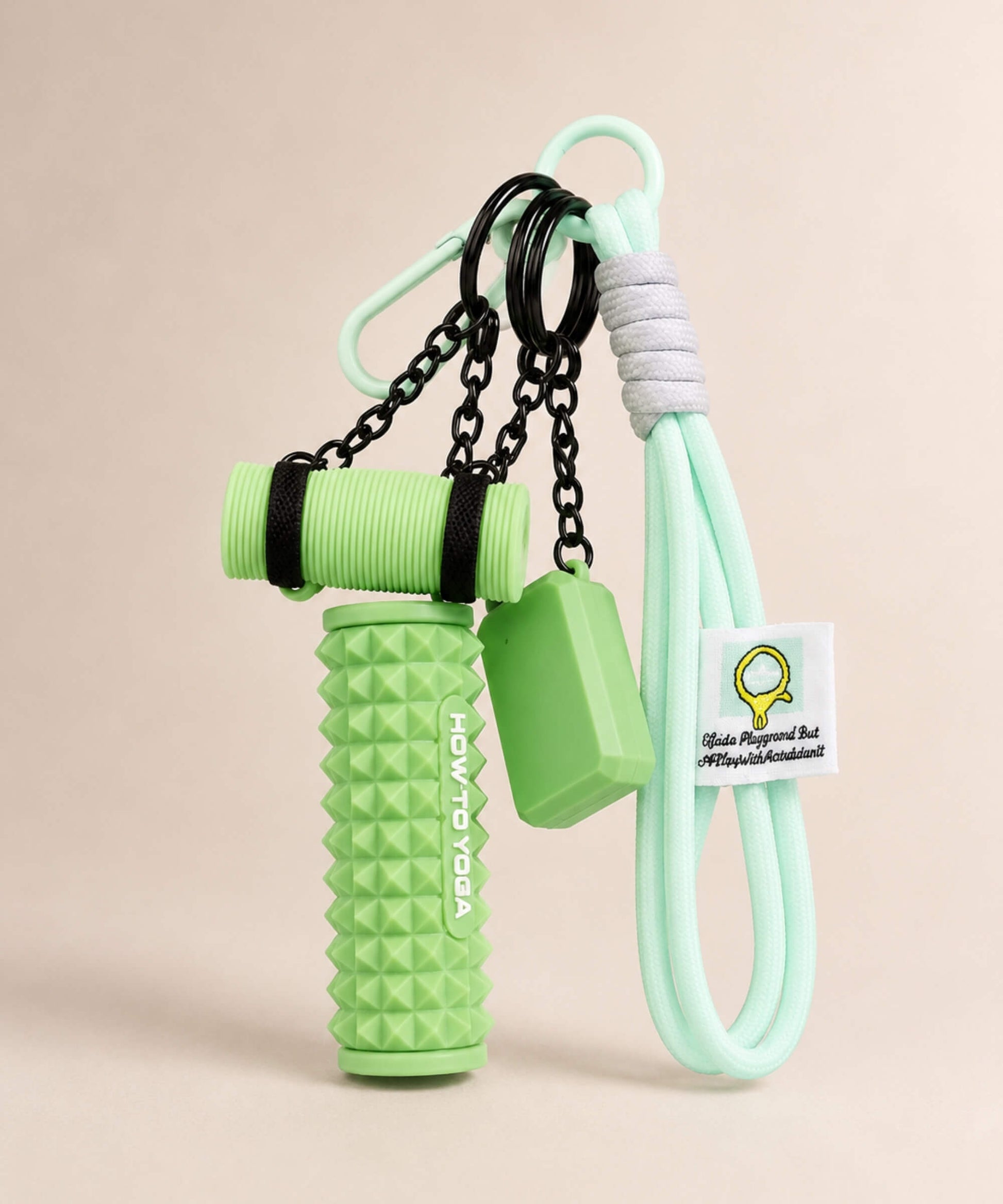 Mint yoga rope keychain with green foam roller charm on a neutral background