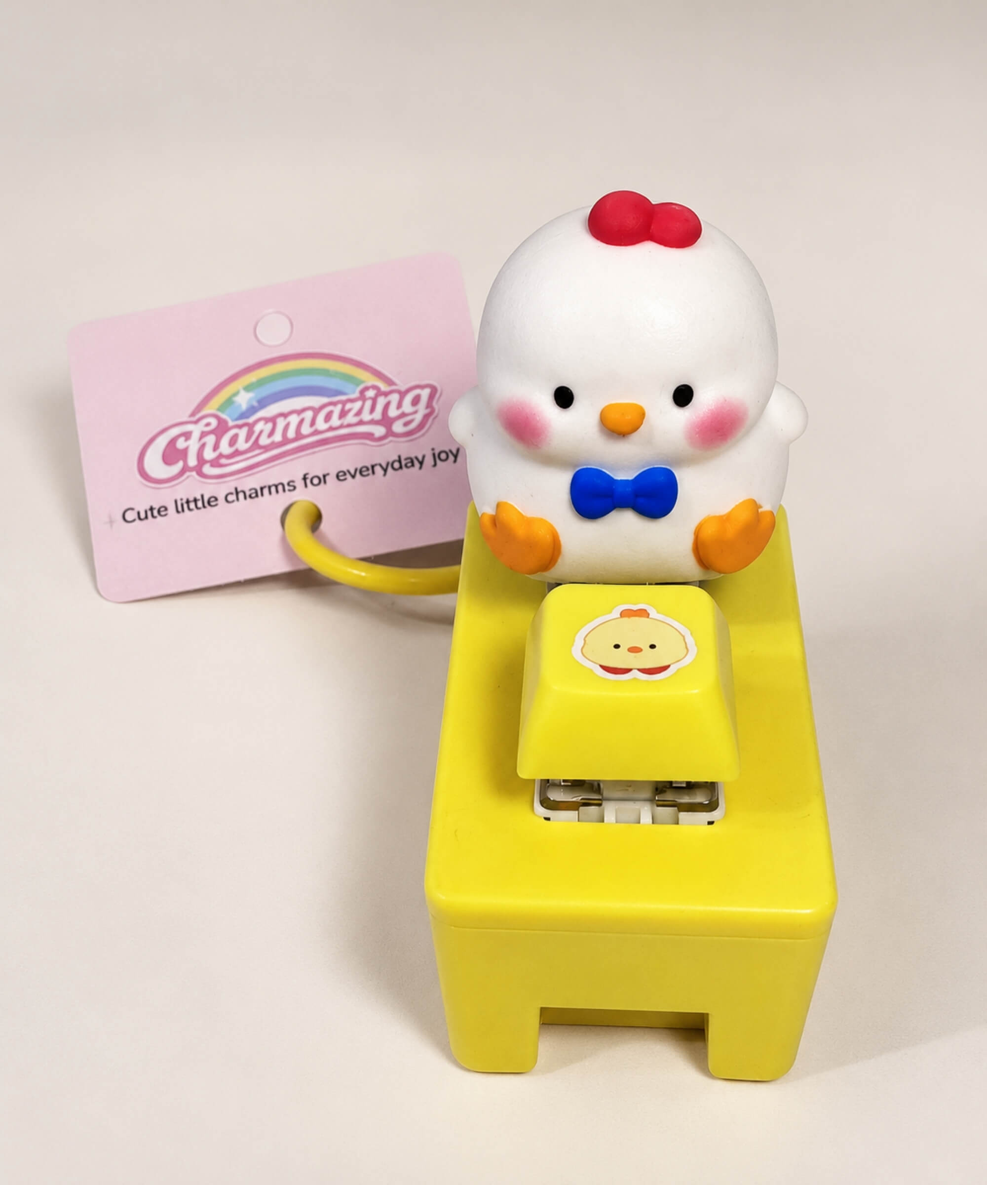 Front view of white chick sound and light button keychain