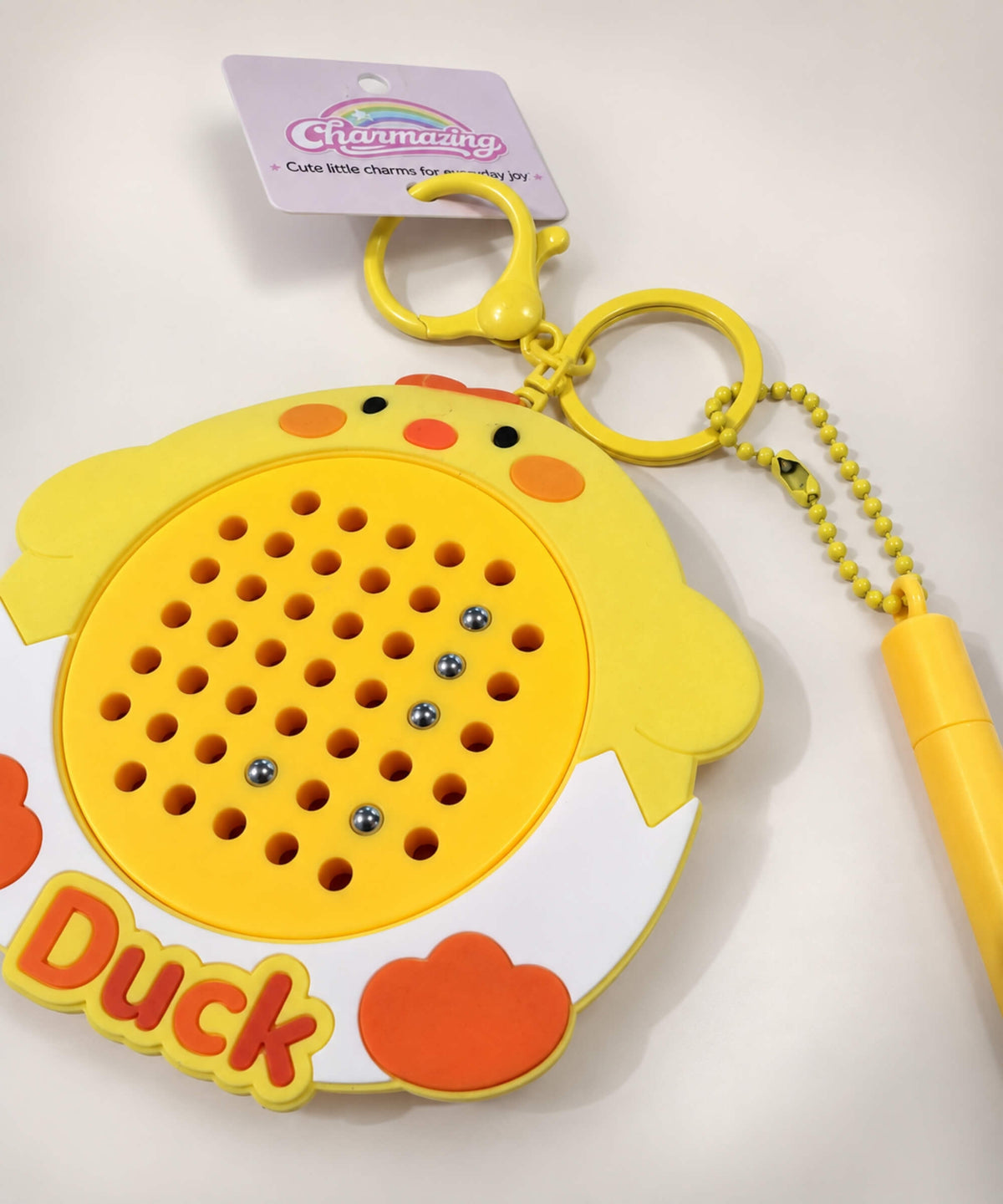 Close-up of Duck magnetic bead drawing keychain with raised magnetic beads