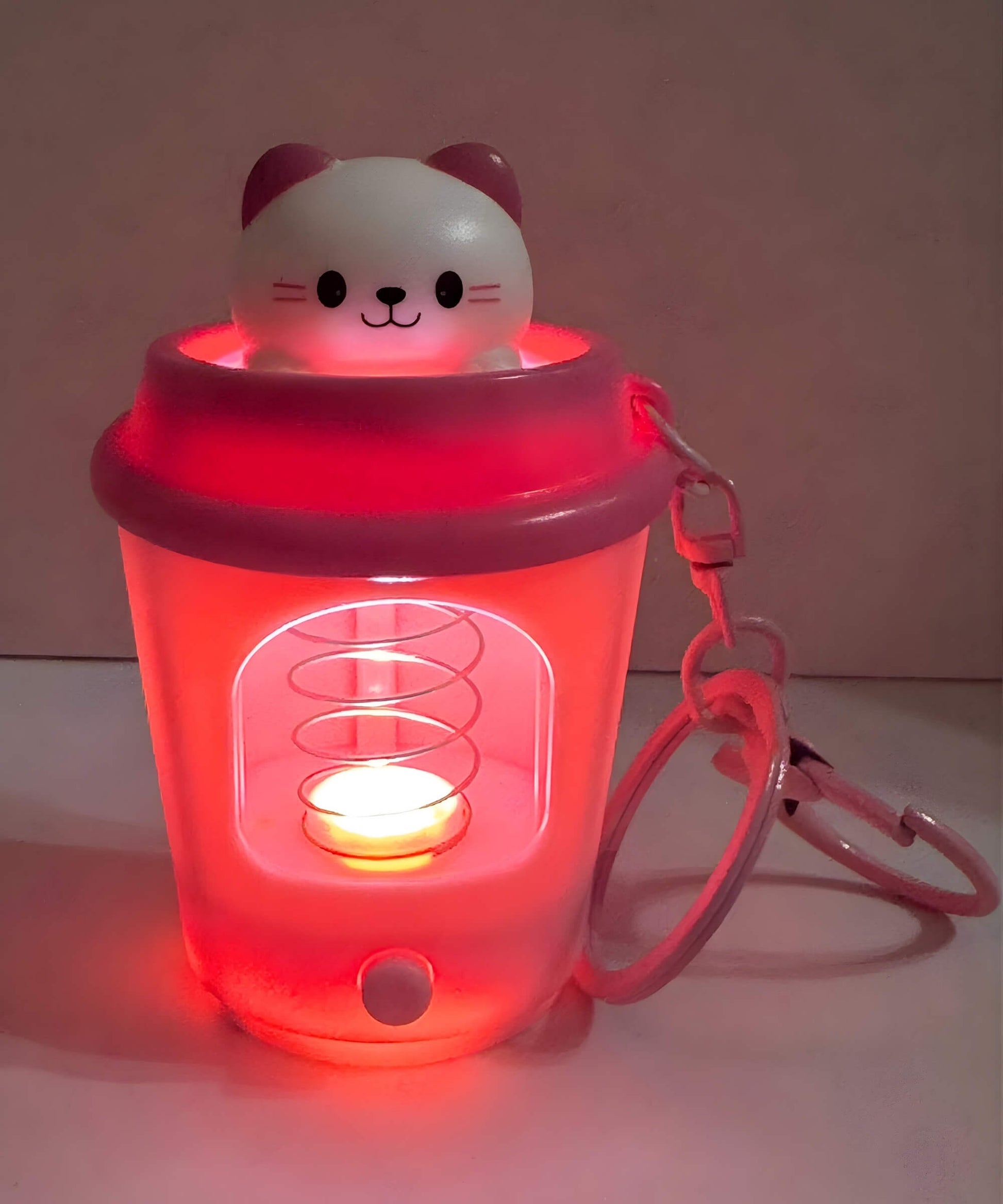 LED coffee cup keychain glowing close-up light-up spring animal charm