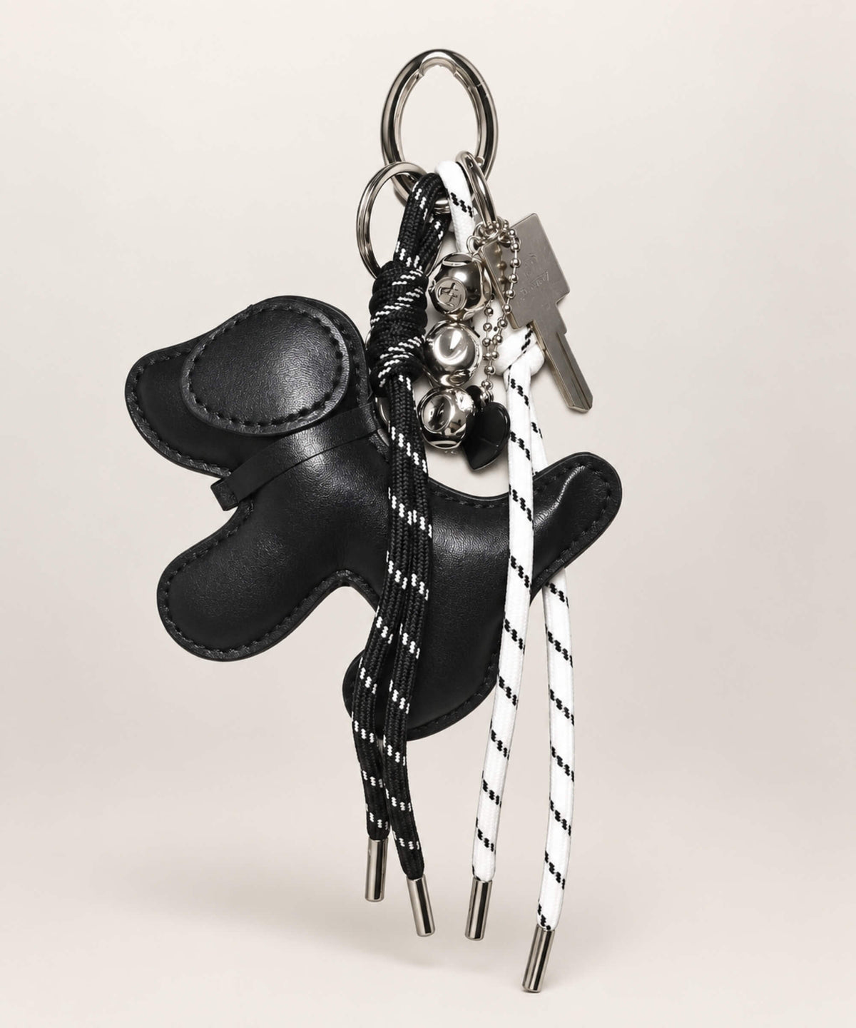 Black dog PU leather bag charm keychain with black and white rope cords and hanging charms