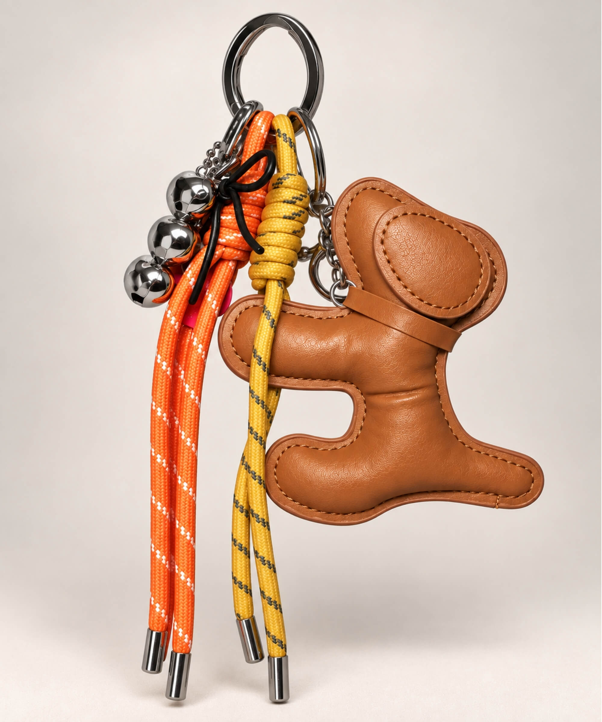 Brown dog PU leather bag charm keychain with orange and yellow rope cords and hanging charms