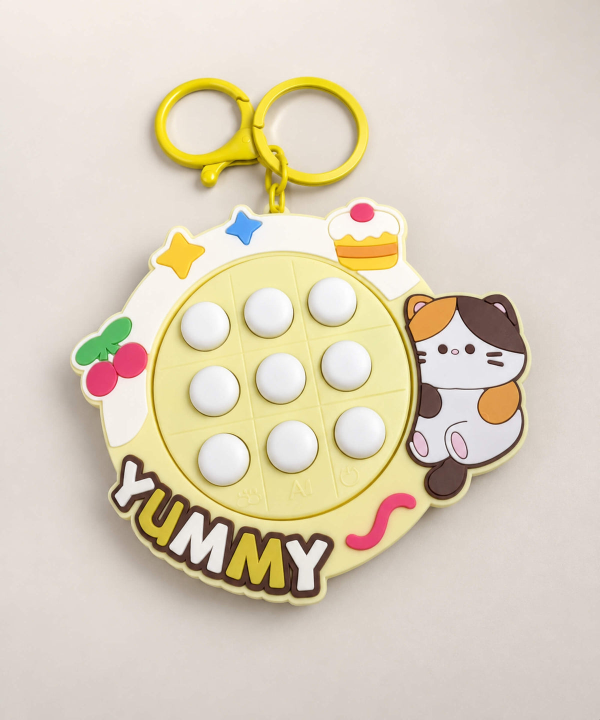 Yellow Yummy Cat electronic Tic Tac Toe game keychain with nine light-up buttons