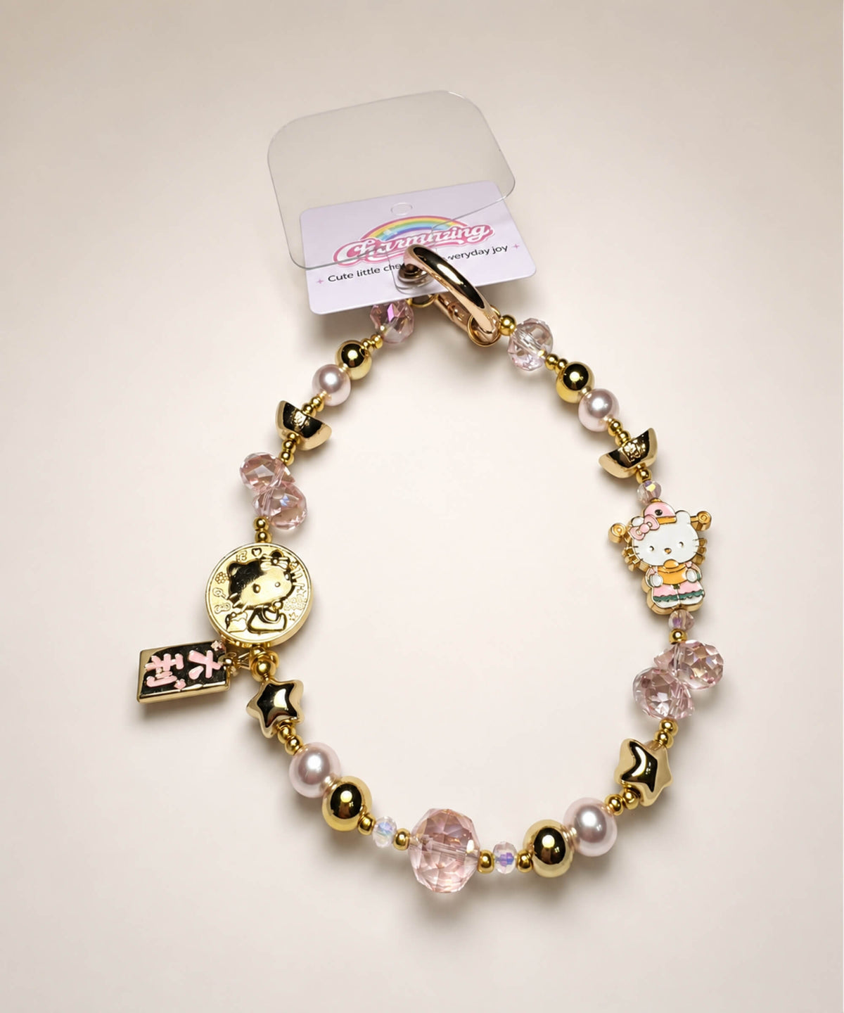 Hello Kitty lucky charm beaded phone charm in Da Ji Da Li style with pink crystal-style beads and gold-tone details