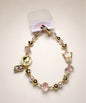 Hello Kitty lucky charm beaded phone charm in Da Ji Da Li style with pink crystal-style beads and gold-tone details
