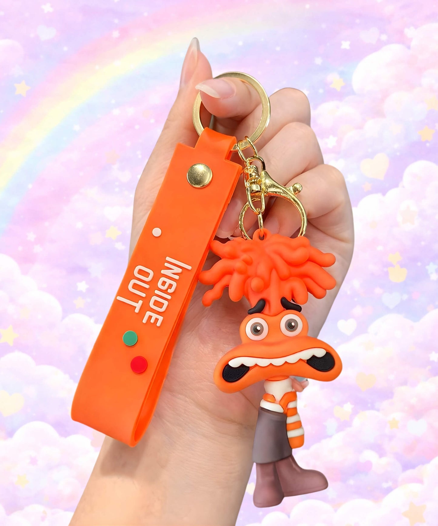 Cute emotion character keychain in orange colour held in hand, cartoon mood bag charm with pastel rainbow background